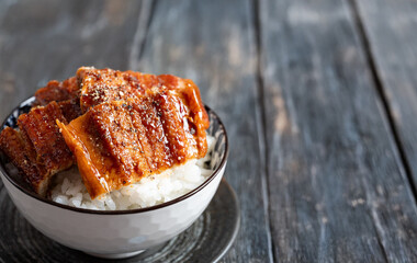a bowl of boiled eel and rice
