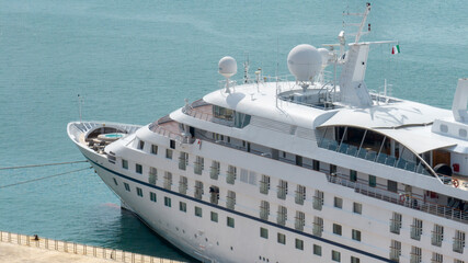 Aerial view of a large white boat anchored in the harbor.