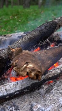 Firewood burns in the fire. The atmosphere is relaxing by the fire.