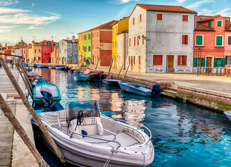 Colorful houses along the canal, island of Burano, Venice, Italy