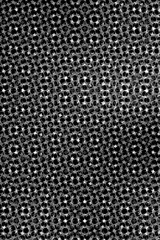 Geometric Abstraction: An artistic black and white close-up captures a mesmerizing geometric pattern, revealing the intricate details of symmetrical design.