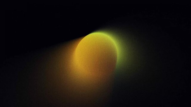 Abstract looping animated background, Glowing blurred orange, yellow and green gradient shape with noise texture on black background