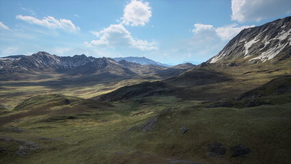 Serene landscape features expansive green hills and rocky mountains with snowcaps. Fluffy clouds drift lazily in the clear sky, showcasing natures beauty at midday.