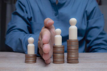 Business concept. Symbol of income inequality, difference in position or reward, allocation of...