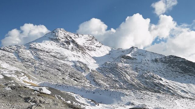 One of the highest peaks of the Ortles massif, the Cristallo with moving clouds in the sky 