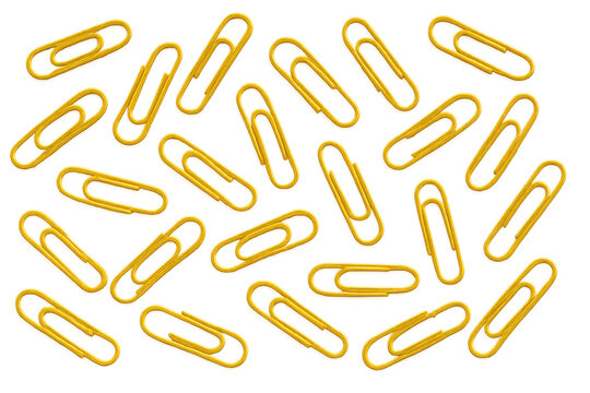 Yellow paper clips scattered creating pattern on transparent background