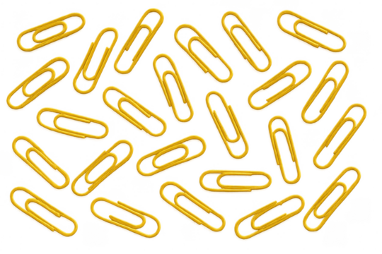 Yellow paper clips scattered creating pattern on transparent background