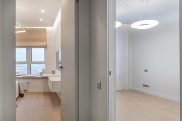 Bright and airy apartment features a stylish living area with contemporary furniture, large windows letting in natural light, and a clean layout perfect for relaxation or entertaining.