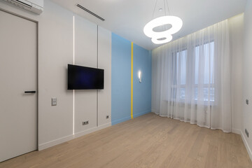 Modern minimalist bedroom with light wood flooring and contemporary decor in a stylish apartment