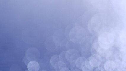 Gentle bokeh effect with soft focus and soothing shades of light blue, representing elegance and purity.