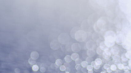 Abstract bokeh background in shades of light blue and white, offering a sense of ethereal beauty