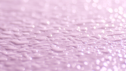 The surface is covered with water drops. the reflection of light on the drops, creating a soft and elegant glow. 