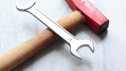 Close-up of hammer and wrench - Powered by Adobe
