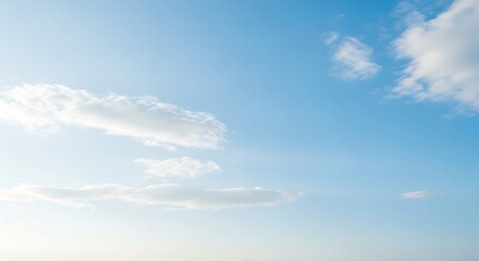 Azure Canvas: The canvas of the sky unveils a tranquil view, with delicate clouds painted across its endless expanse. A vision of purity, clarity and serene escape.