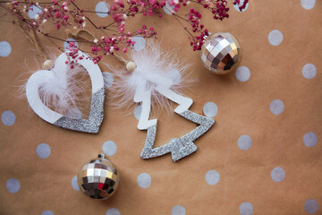 Christmas festive background with basic classic pattern, copy space. Trendy decorations with disco balls and pink gypsophila. Christmas atmosphere. Merry Christmas and home coziness concept