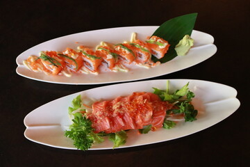 Delicious sushi rolls, a mouthwatering culinary treat. The sushi rolls are arranged on a elegant...