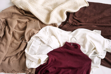 The top view of the autumn women's capsule wardrobe lies on the floor.