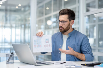 Man explaining a business process flowchart during a remote online video conference, discussing project data and technical architecture with colleagues
