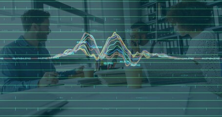 Reviewing data overlay and documents, three colleagues collaborating at modern office with laptops