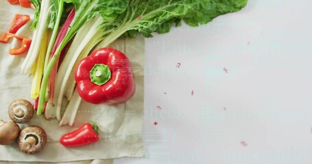 Displaying greens, mushrooms, bell and chili peppers lying on kitchen cloth, copy space