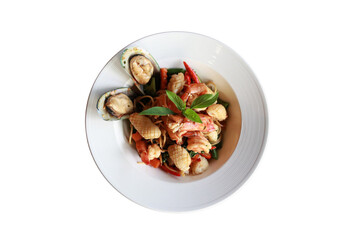 Delicious seafood dish on a white plate, viewed from above, showcasing mussels, prawns, and other culinary elements 