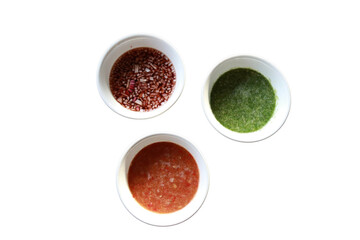 Variety of colorful sauces in white bowls, a culinary delight and appetizing presentation.