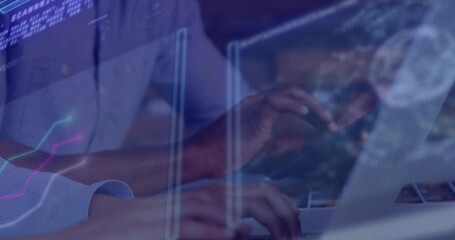 Typing analyst wearing long sleeve shirt at desk showing laptop keyboard with graph text overlays