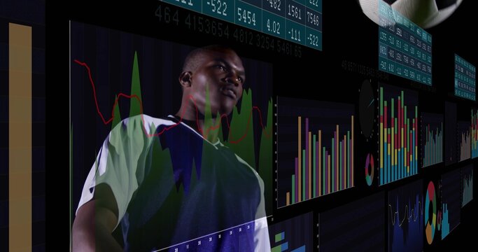 Monitoring adult male in sports shirt studying finance dashboards in control hub, floating charts