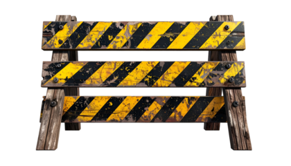 Weathered wooden barricade with yellow and black stripes, isolated against black background