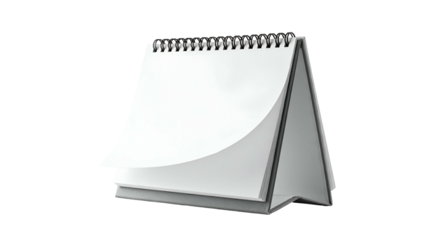 A blank, white spiral-bound desk calendar with a page partially turned