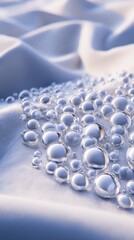 Close-up of glistening water droplets on soft fabric, creating a serene, calming atmosphere