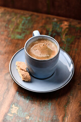 Cup of coffee on rustic wooden background. Soft focus. Copy space	