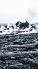 Volcanic eruption with lava flow and steam rising from the crater