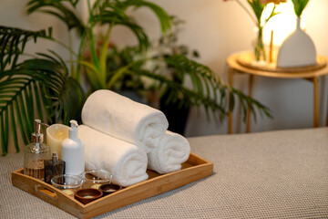 Spa wellness treatment essentials serene atmosphere clean towels aroma oils candles creating peaceful relaxing experience home resort environment
