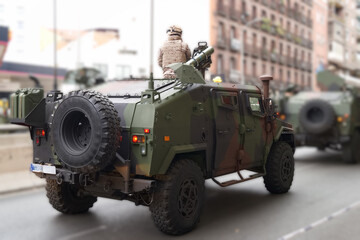 Military vehicles on city street during security operation in urban area