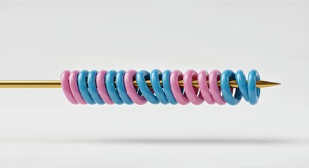 A close-up shot of a golden needle with alternating pink and blue plastic rings threaded onto it.