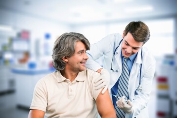 Fototapeta premium Doctor or nurse with patient during visit to clinic.