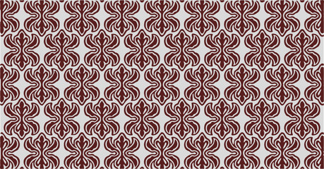 Seamless decorative pattern with symmetrical red shapes forming traditional abstract texture.