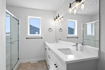 Bathroom with a shower and two sinks