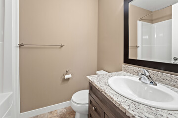 Bathroom with a white sink and toilet