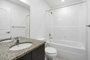 Bathroom with a white tub and sink