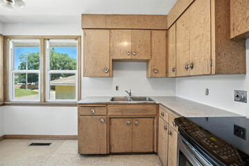 Kitchen with a black stove and a sink