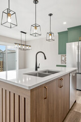 Kitchen with a white countertop and a stainless steel sink