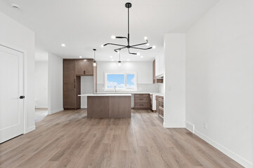 Large open kitchen with a white counter and cabinets