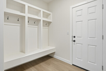 White door with a black handle and a white knob