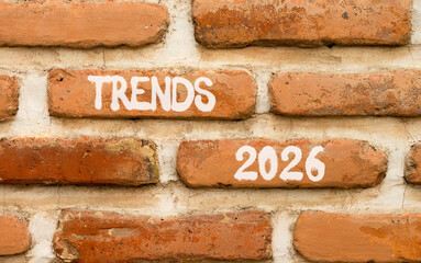 Trends 2026 new year symbol. Concept words Trends 2026 on beautiful brown brick wall. Beautiful brown brick wall background. Business and Trends 2026 new year concept. Copy space.