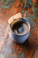 Cup of coffee on rustic wooden background. Soft focus. Copy space	