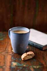 Cup of coffee on rustic wooden background. Soft focus. Copy space	