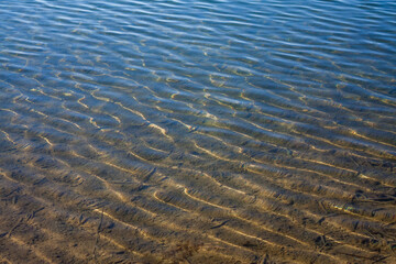 Sandy Lake Bottom under Crystal Clear Water