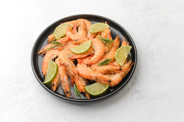 Shrimp and lime arranged in white plate for gourmet lunch or elegant seafood concept